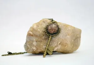 Antiqued Brass Flowered Skeleton Key with Fused Glass Orange Dichroic cabochon on 24 inch brass plated chain