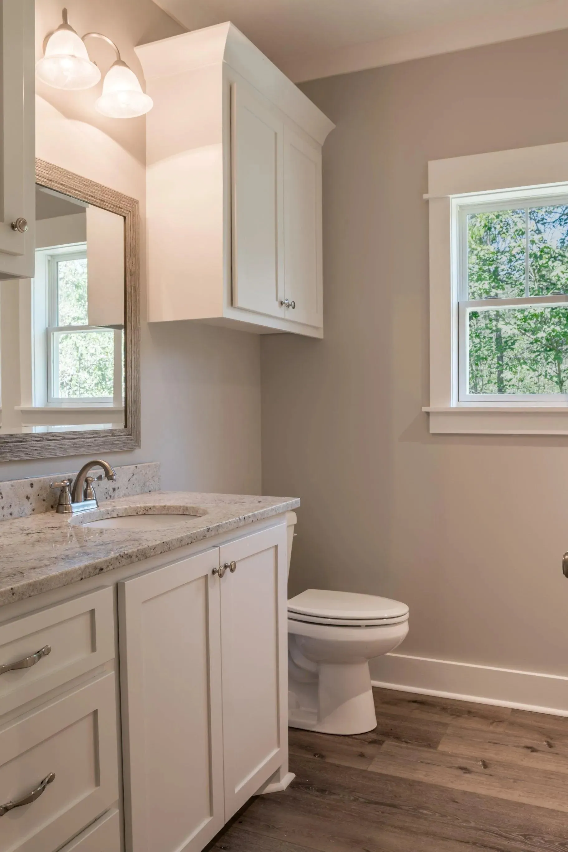 Elegant family home with spacious living, bonus room, and outdoor kitchen.