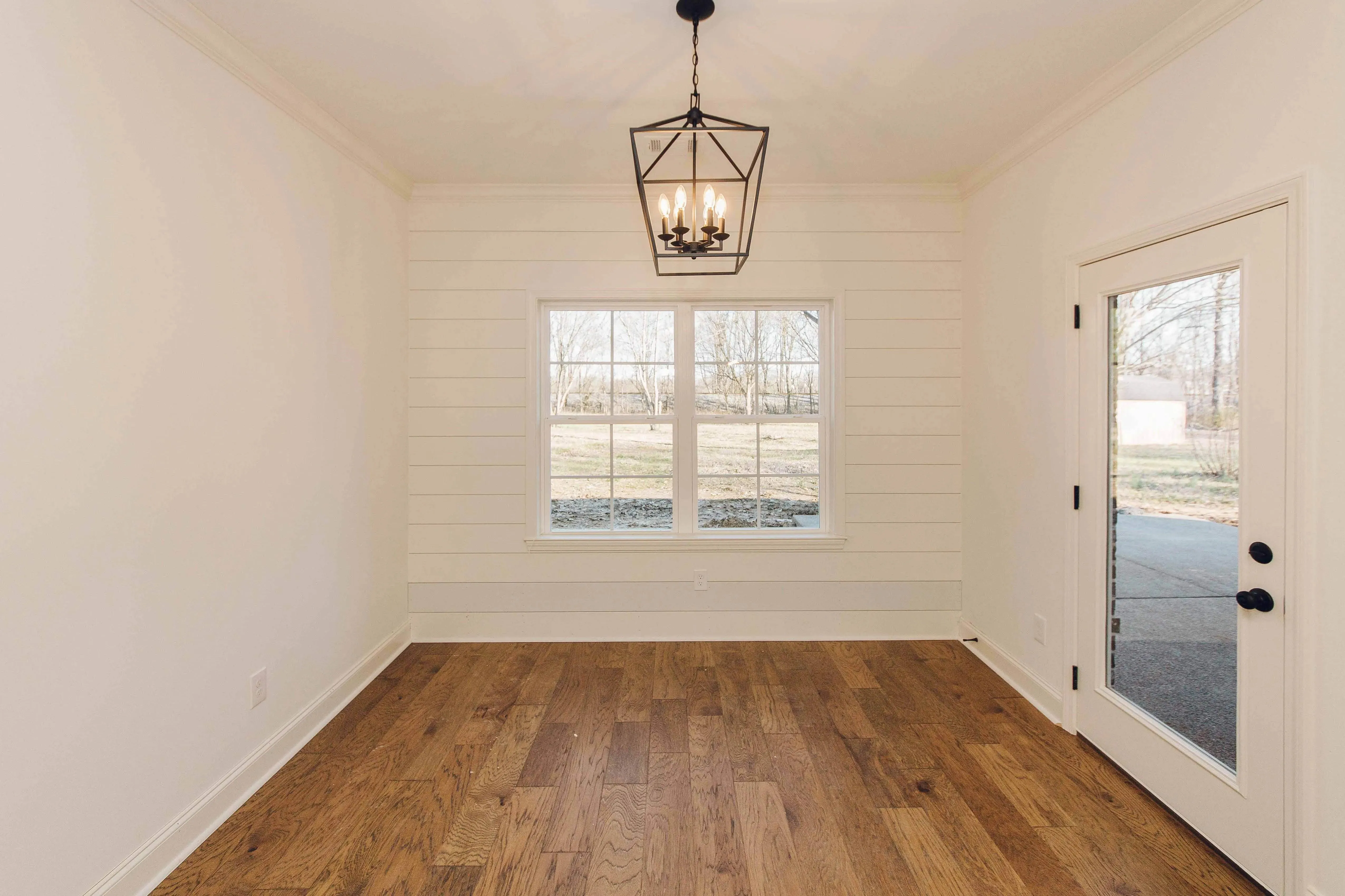 Elegant family home with spacious living, bonus room, and outdoor kitchen.
