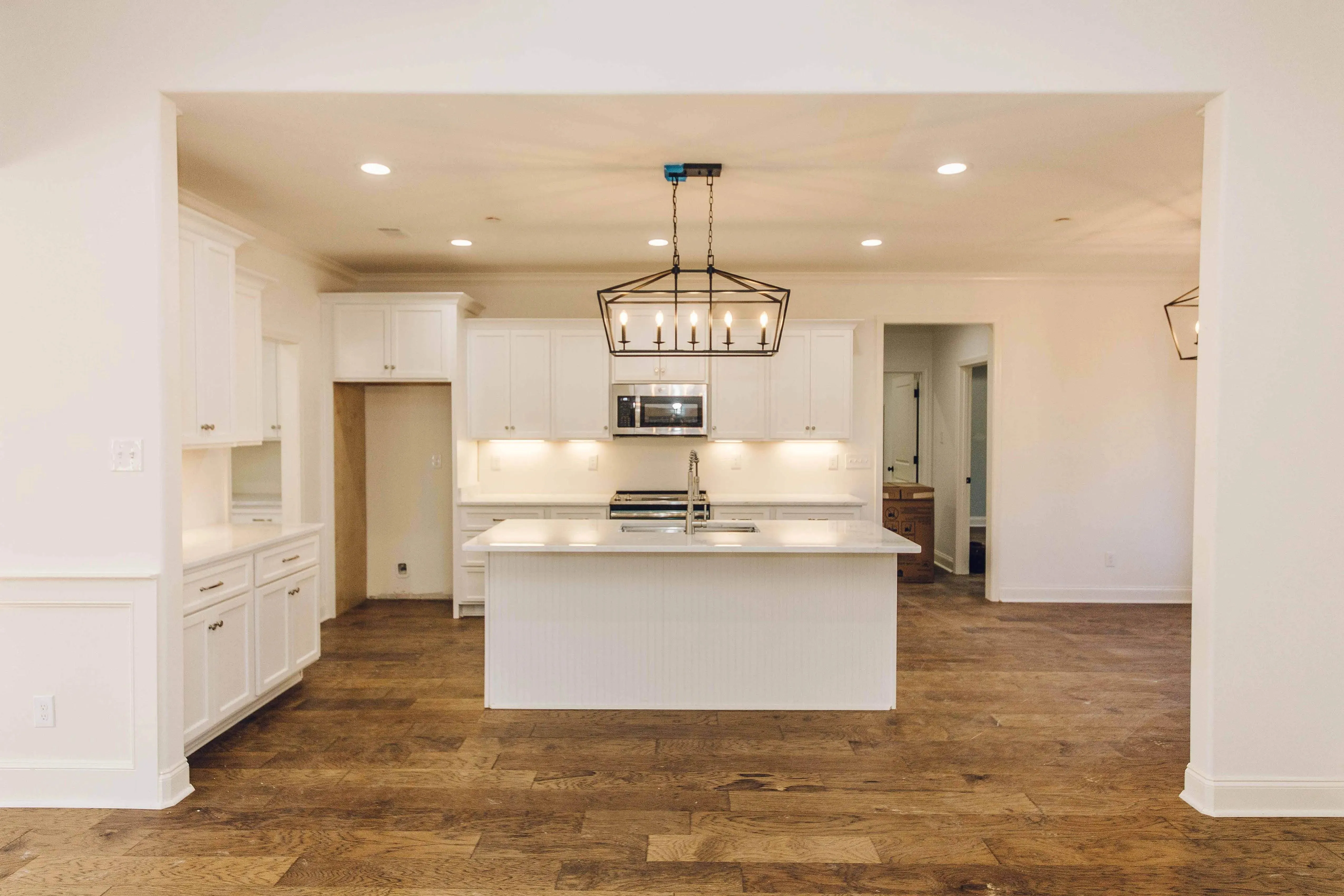 Elegant family home with spacious living, bonus room, and outdoor kitchen.