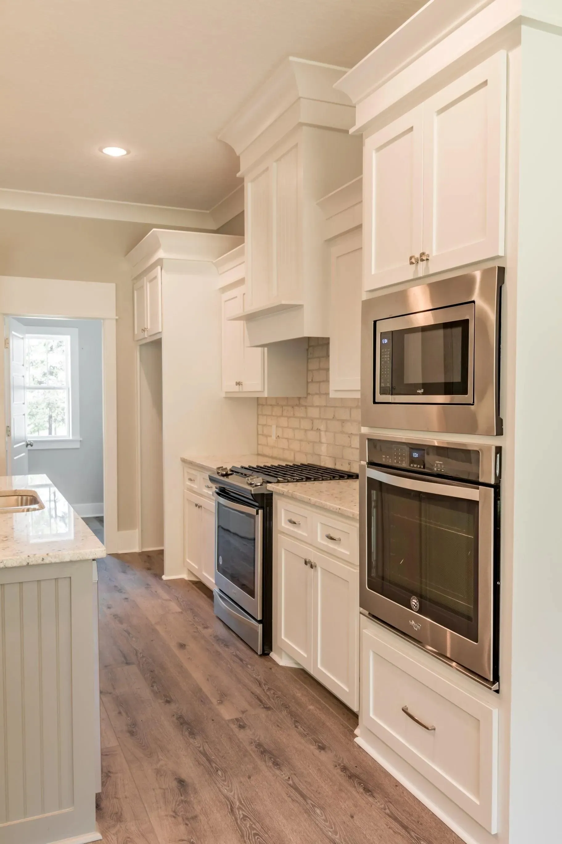 Elegant family home with spacious living, bonus room, and outdoor kitchen.