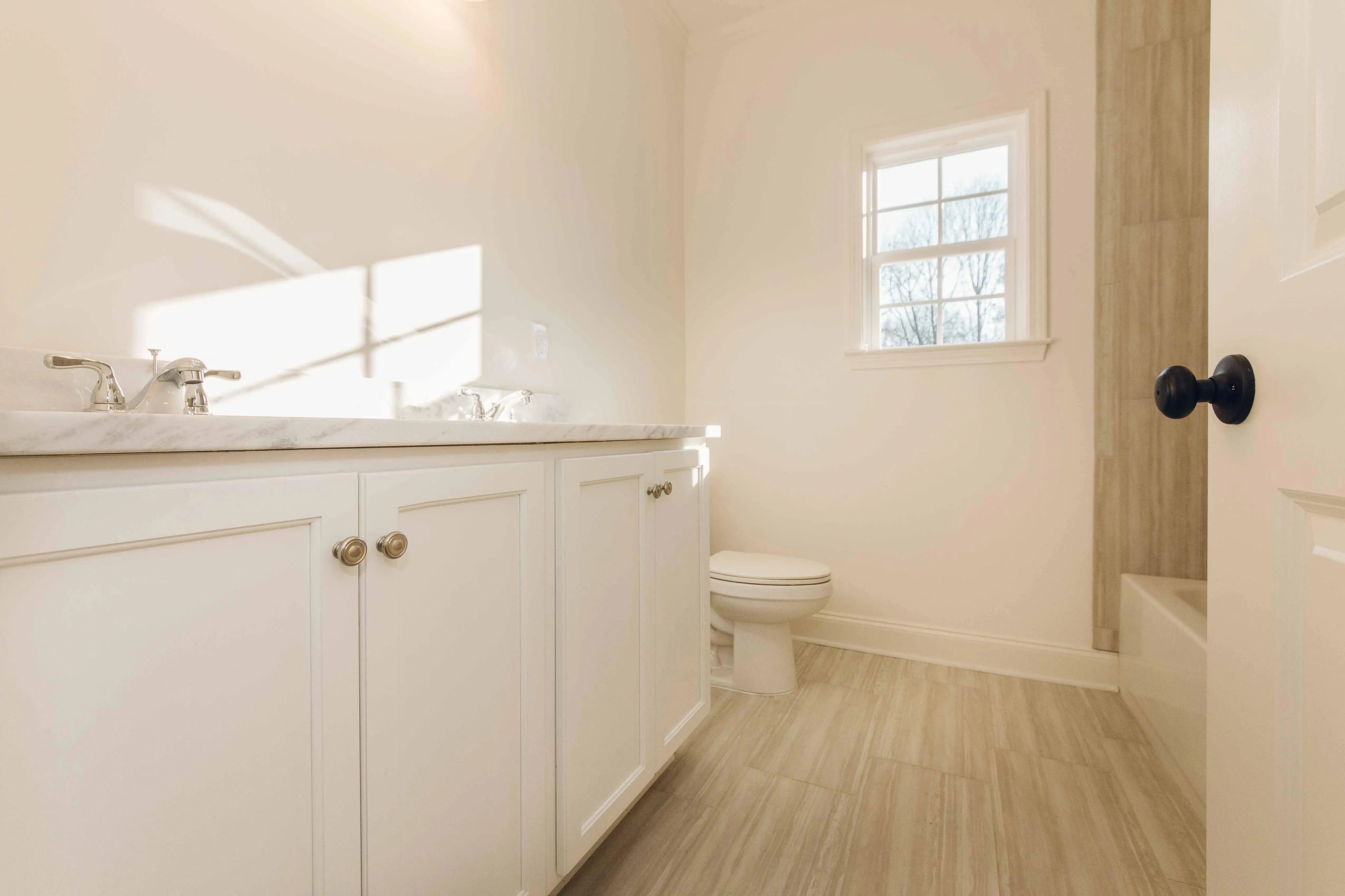 Elegant family home with spacious living, bonus room, and outdoor kitchen.
