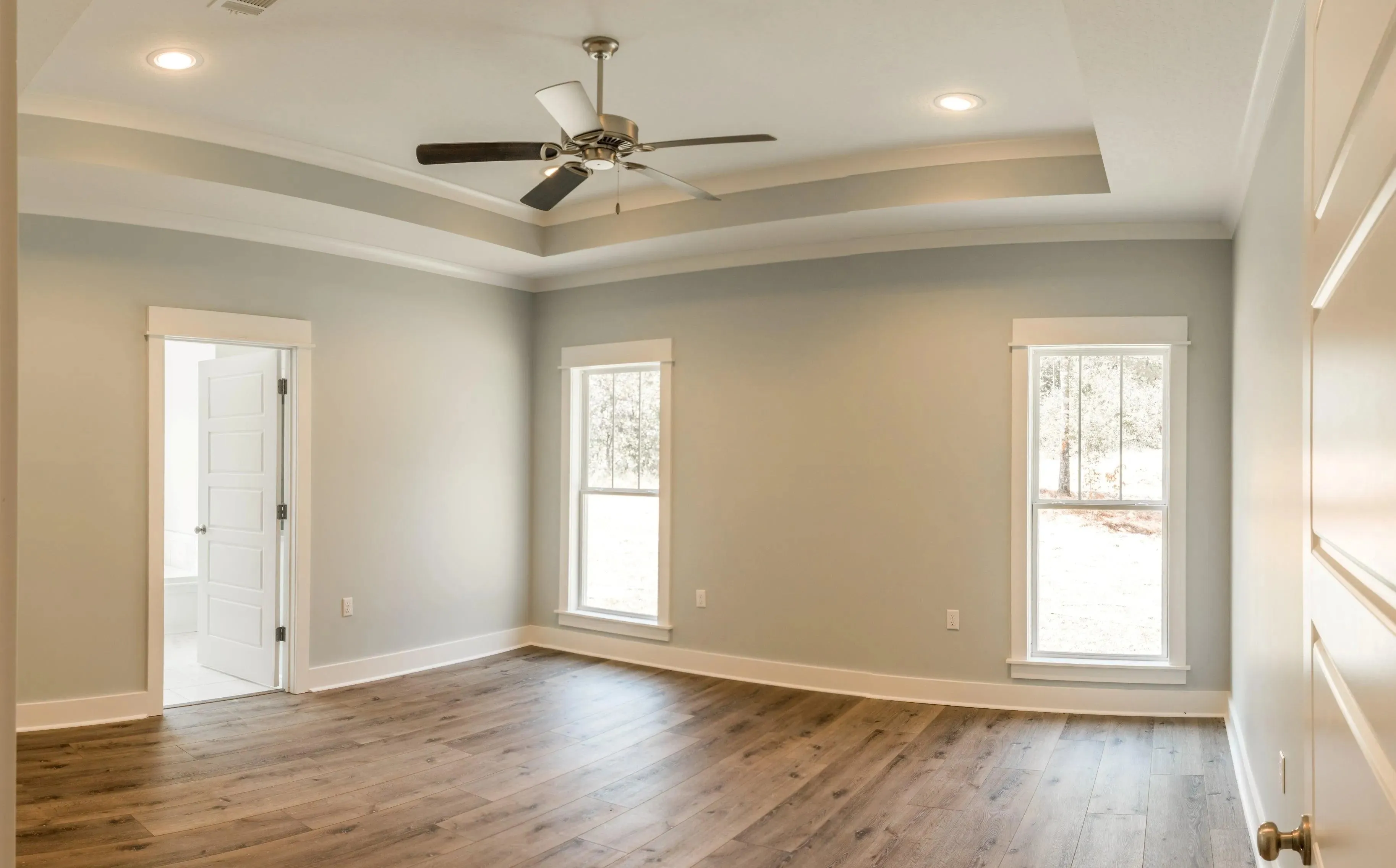 Elegant family home with spacious living, bonus room, and outdoor kitchen.