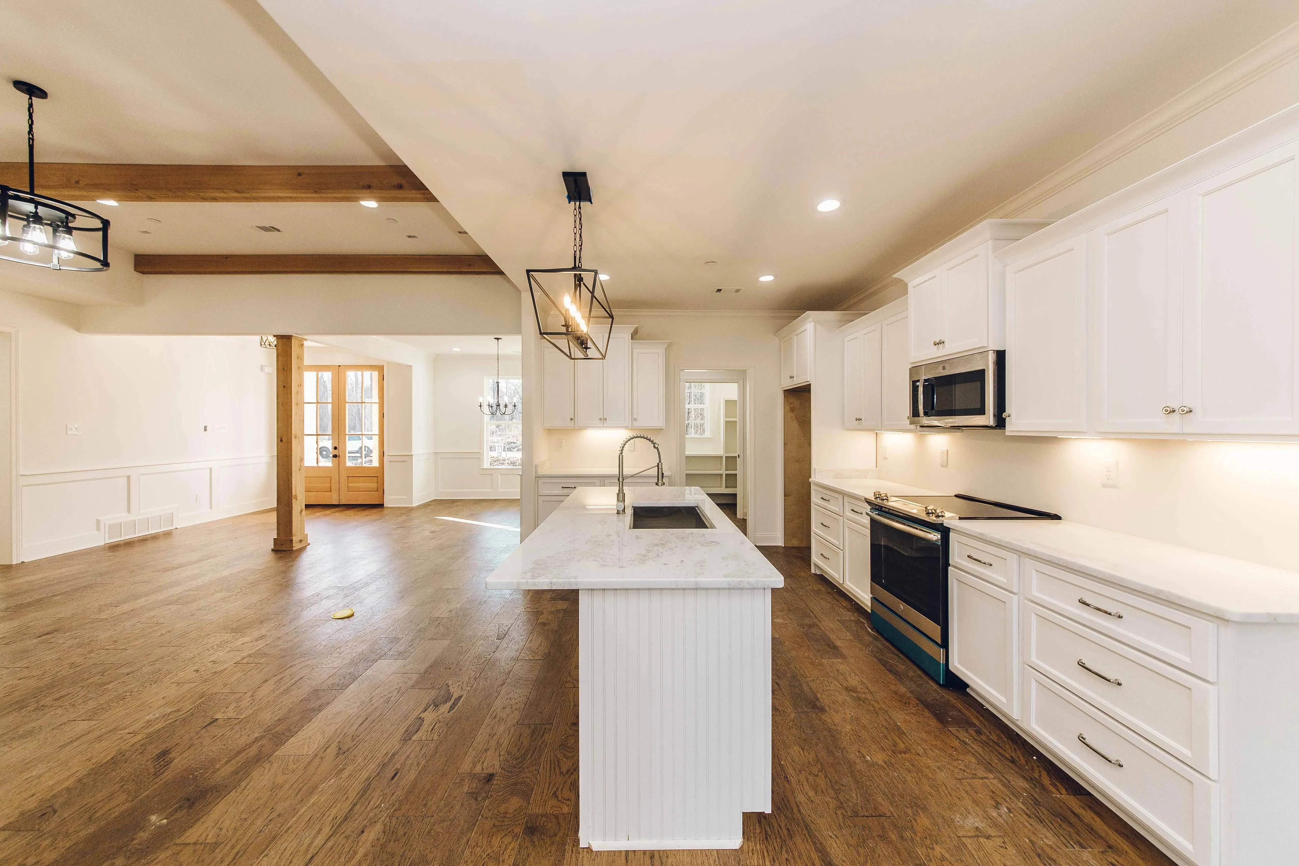 Elegant family home with spacious living, bonus room, and outdoor kitchen.