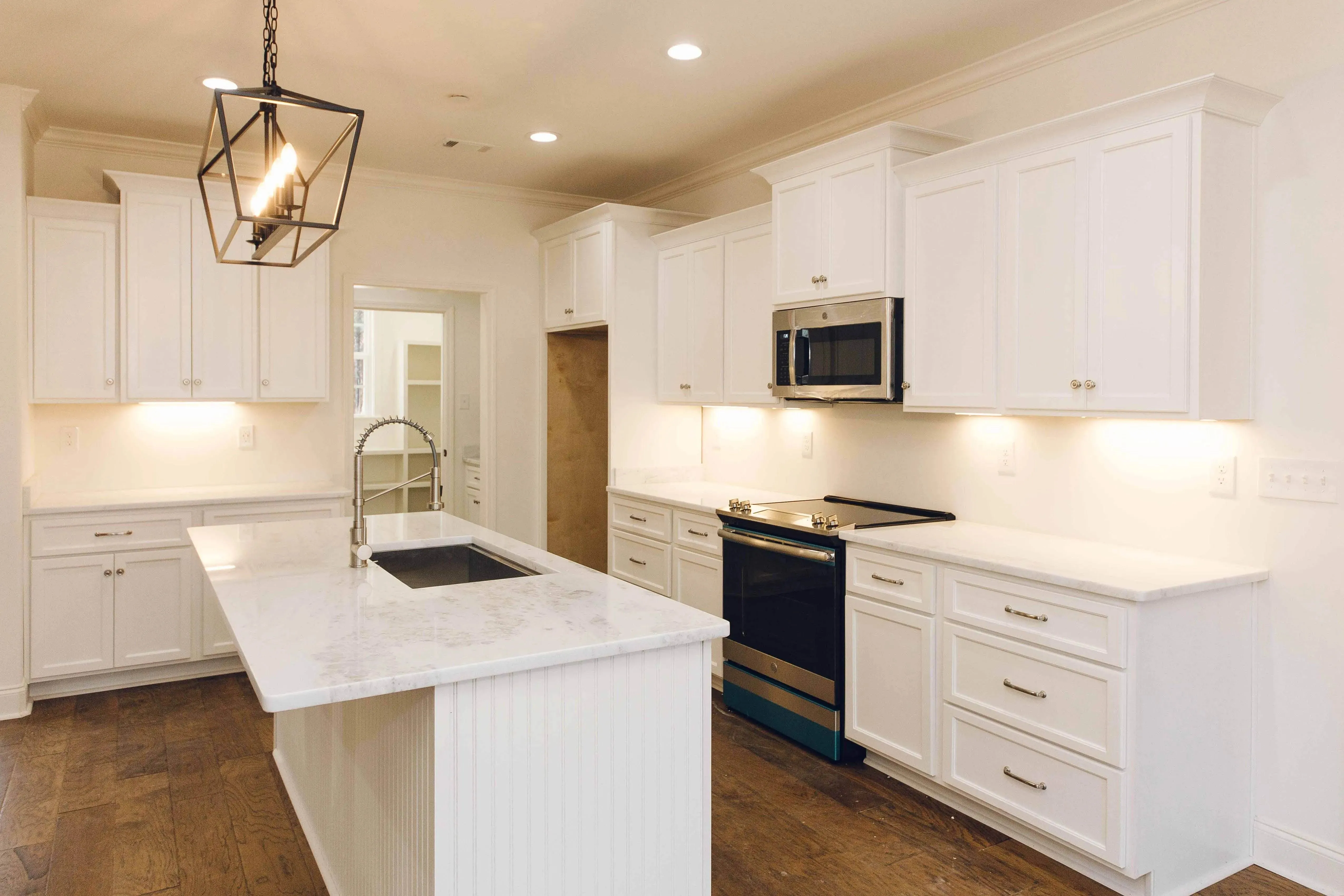 Elegant family home with spacious living, bonus room, and outdoor kitchen.