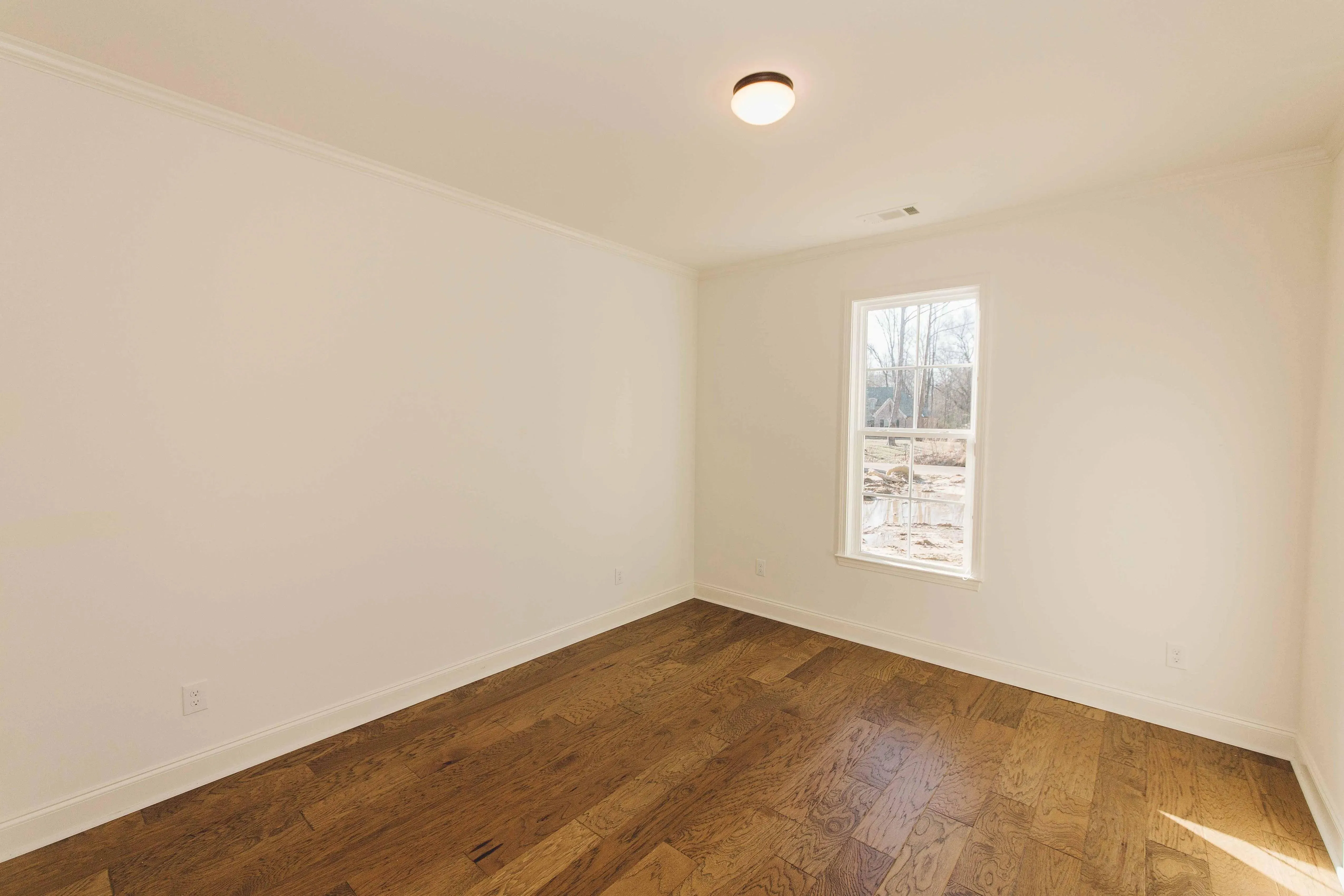 Elegant family home with spacious living, bonus room, and outdoor kitchen.