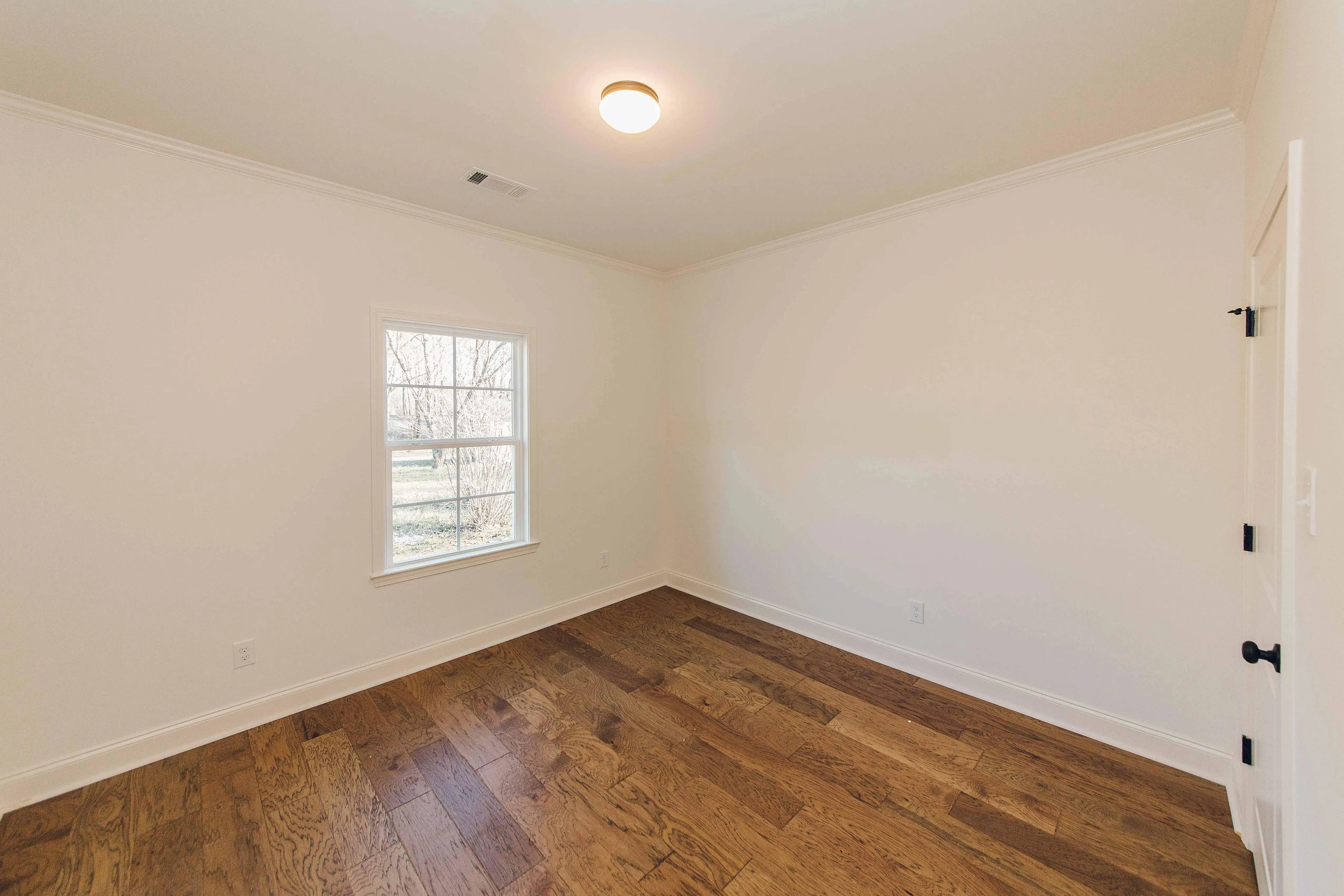 Elegant family home with spacious living, bonus room, and outdoor kitchen.