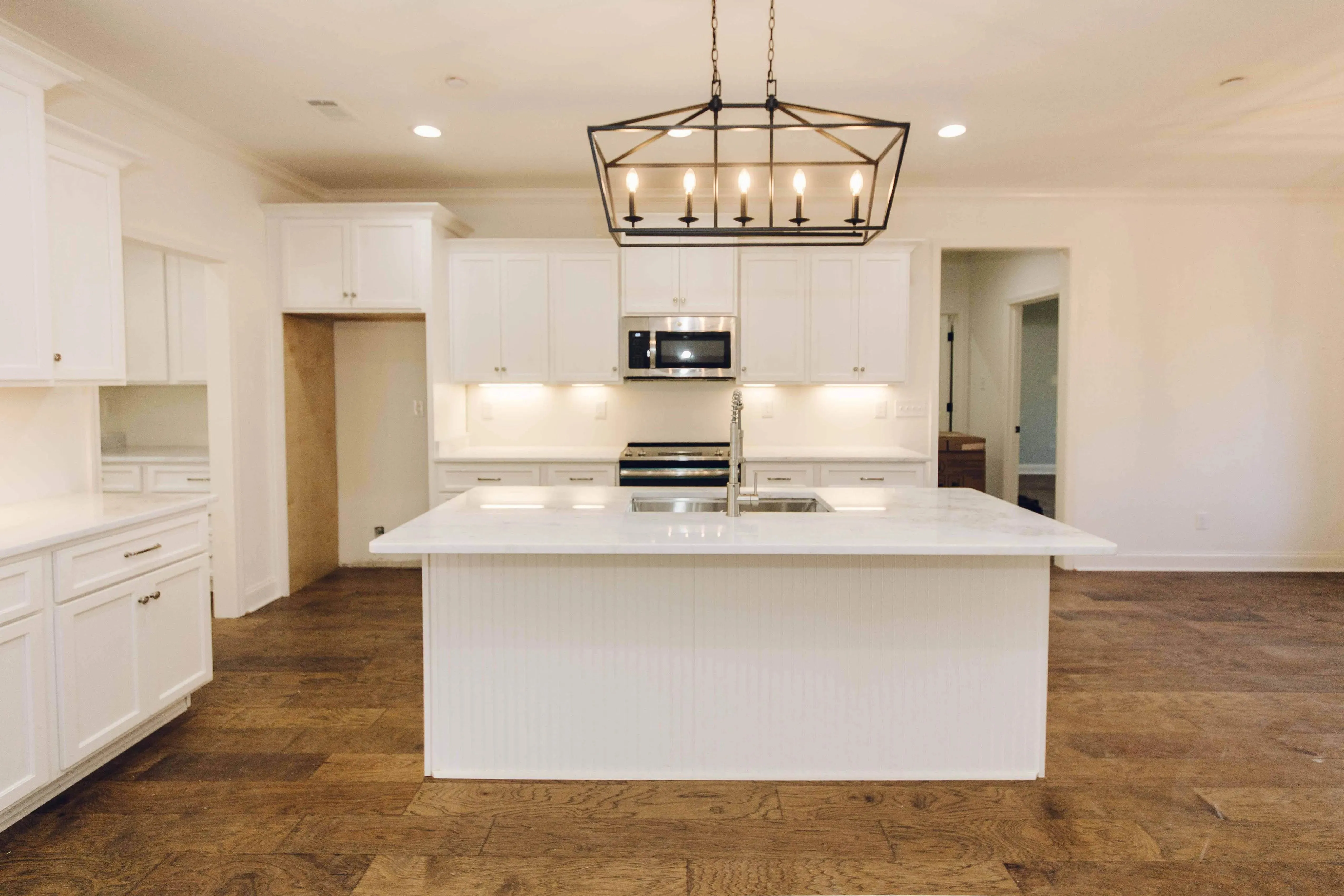 Elegant family home with spacious living, bonus room, and outdoor kitchen.