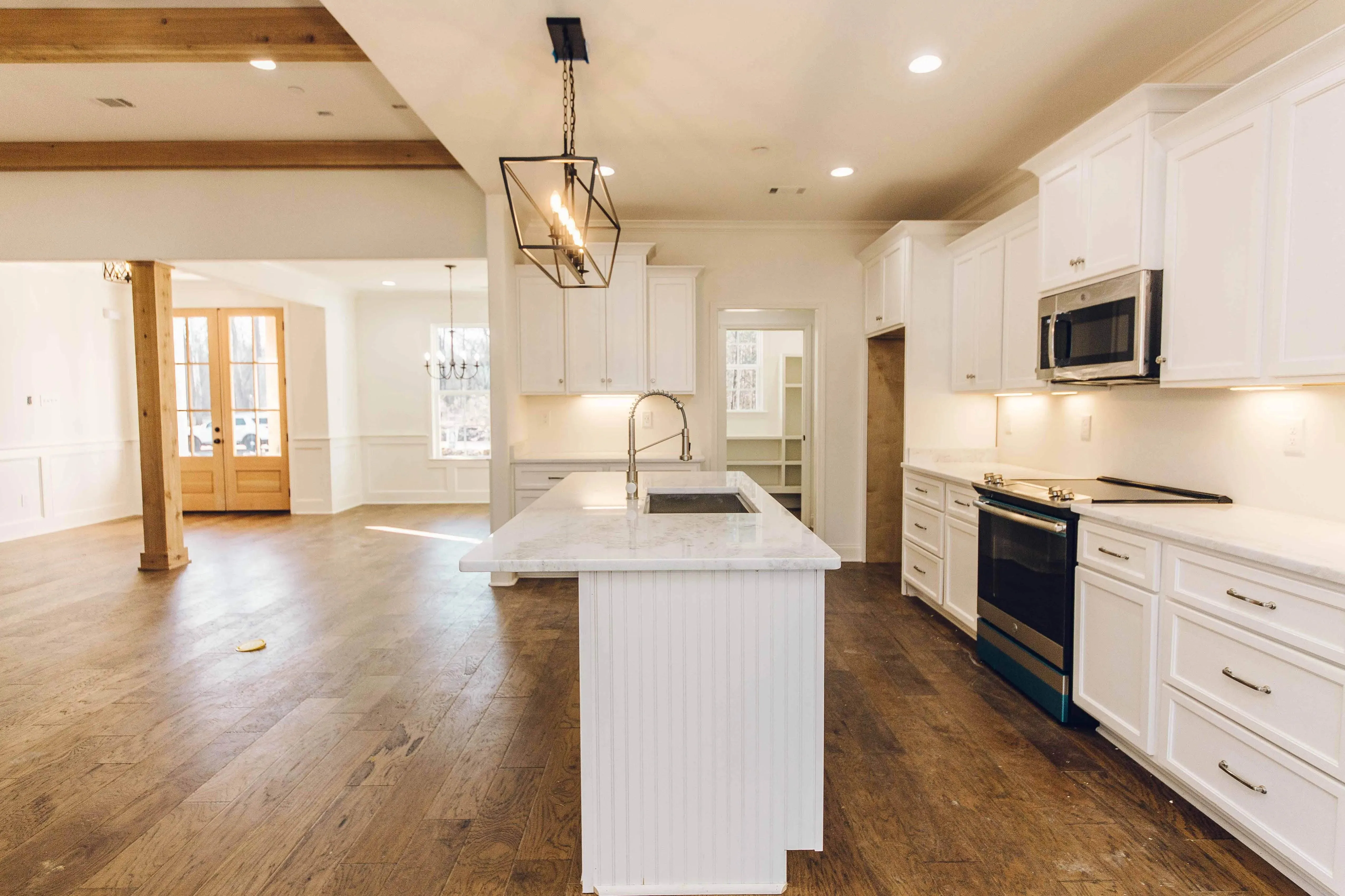 Elegant family home with spacious living, bonus room, and outdoor kitchen.