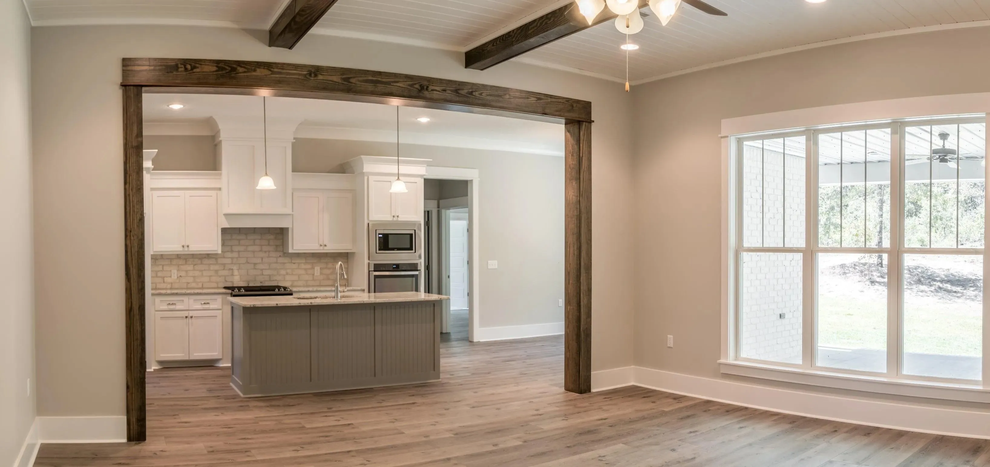 Elegant family home with spacious living, bonus room, and outdoor kitchen.