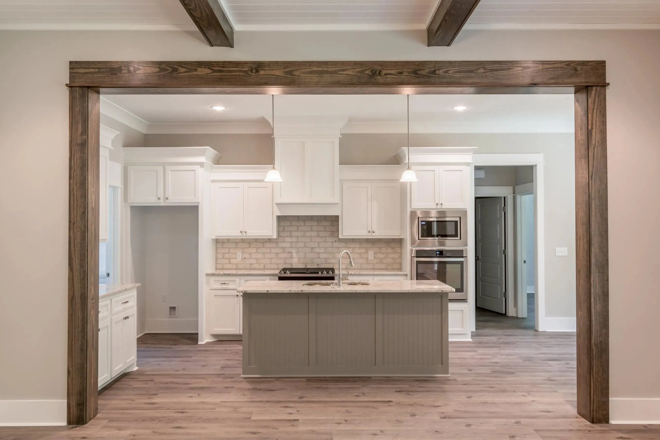 Elegant family home with spacious living, bonus room, and outdoor kitchen.