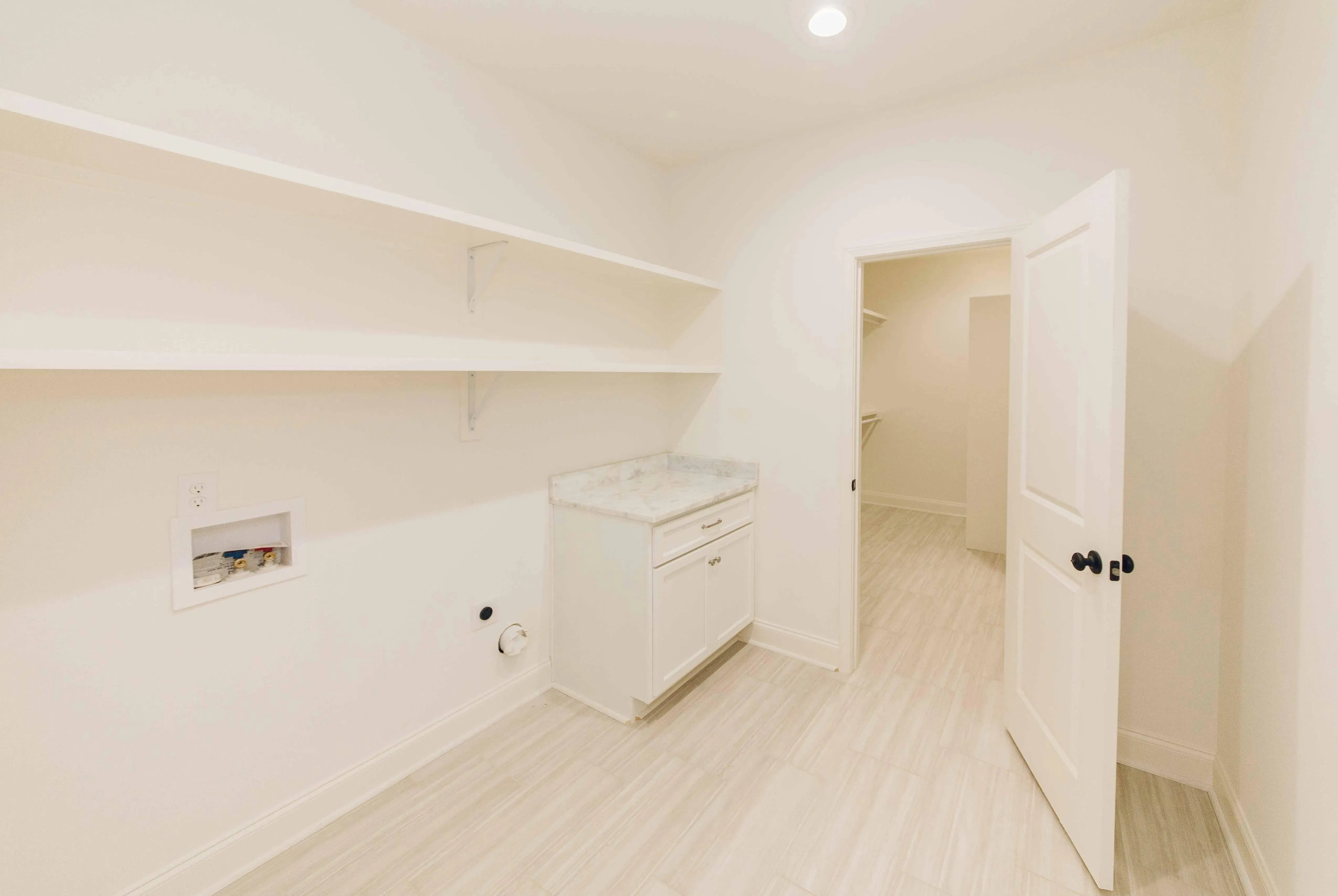 Elegant family home with spacious living, bonus room, and outdoor kitchen.