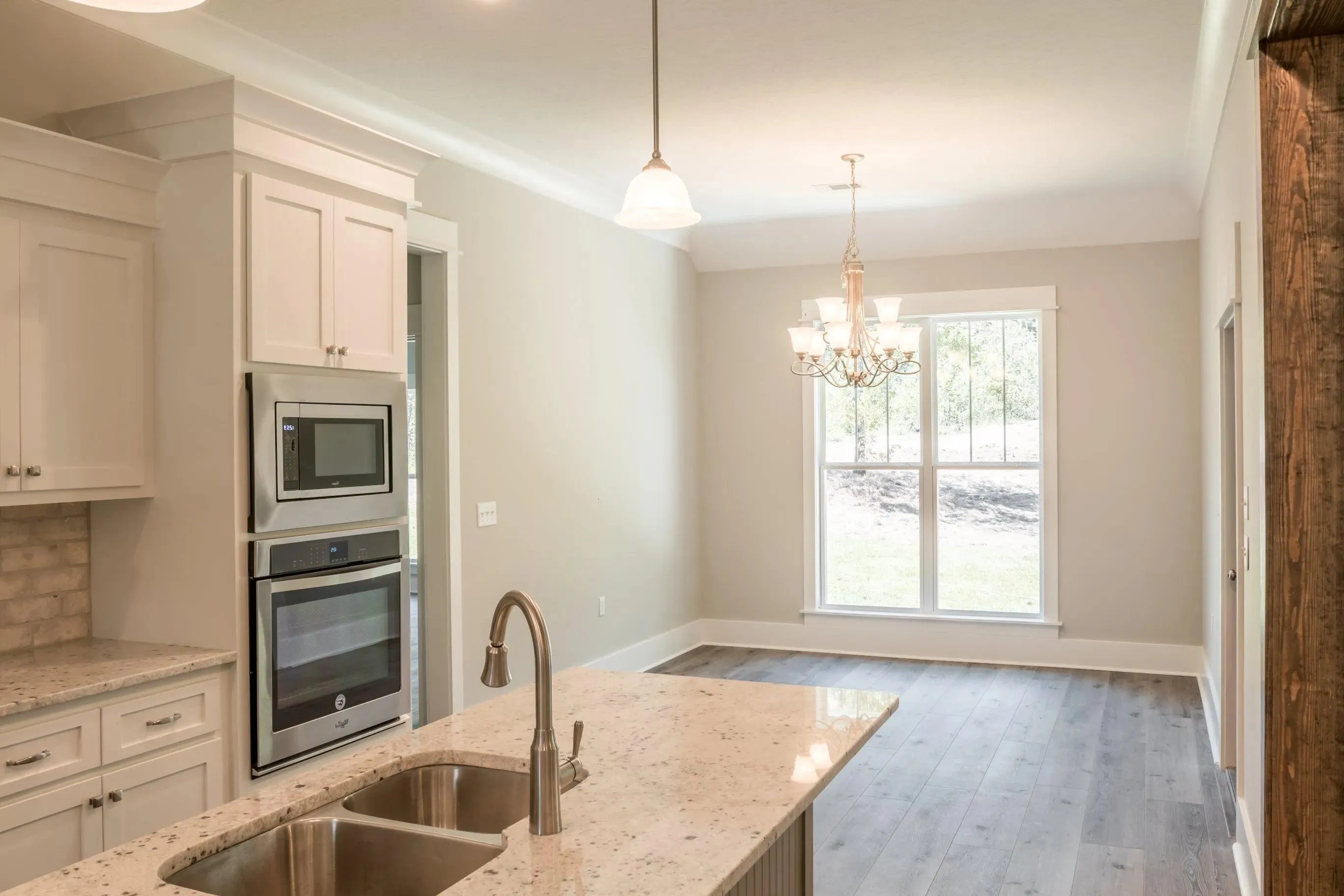 Elegant family home with spacious living, bonus room, and outdoor kitchen.