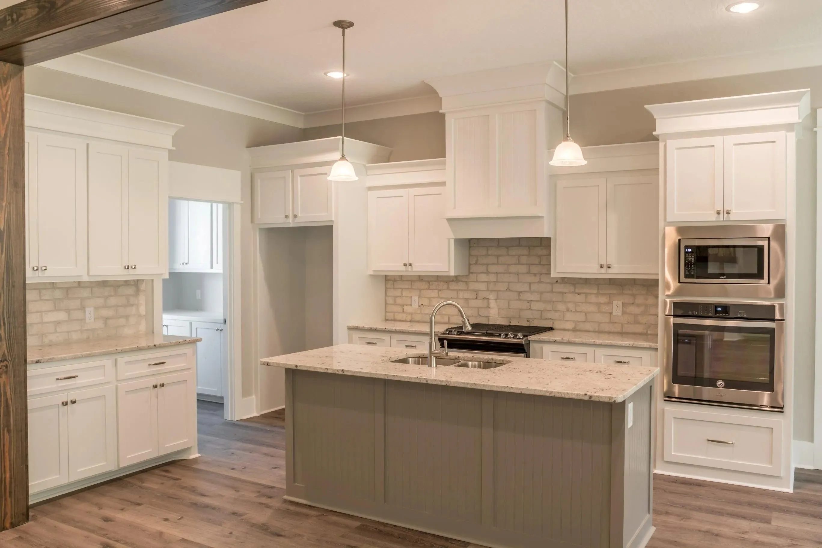 Elegant family home with spacious living, bonus room, and outdoor kitchen.