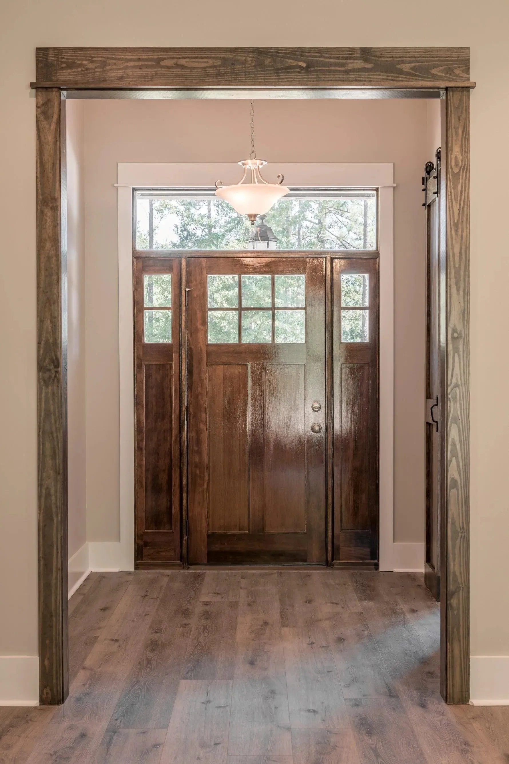 Elegant family home with spacious living, bonus room, and outdoor kitchen.