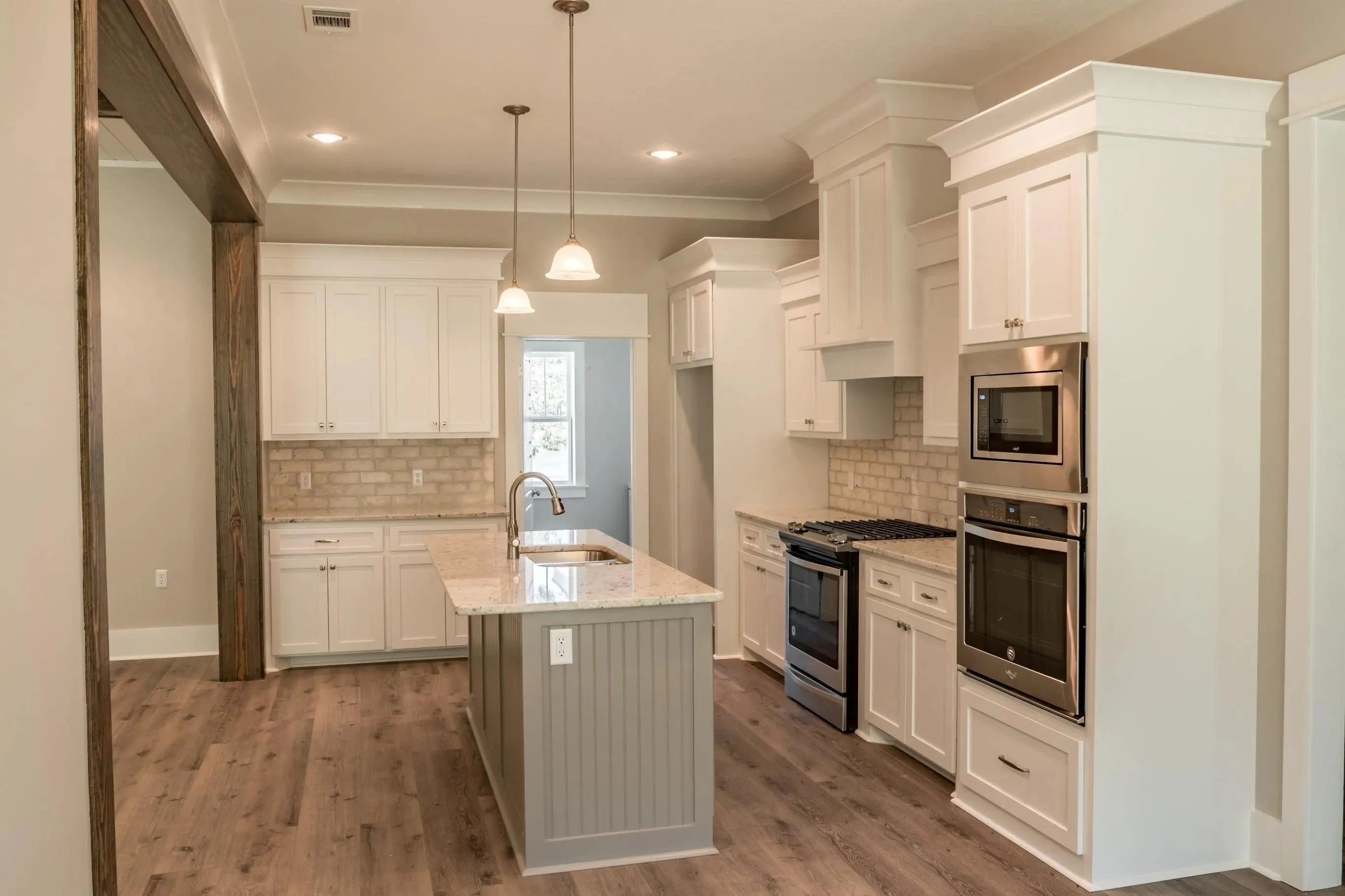 Elegant family home with spacious living, bonus room, and outdoor kitchen.