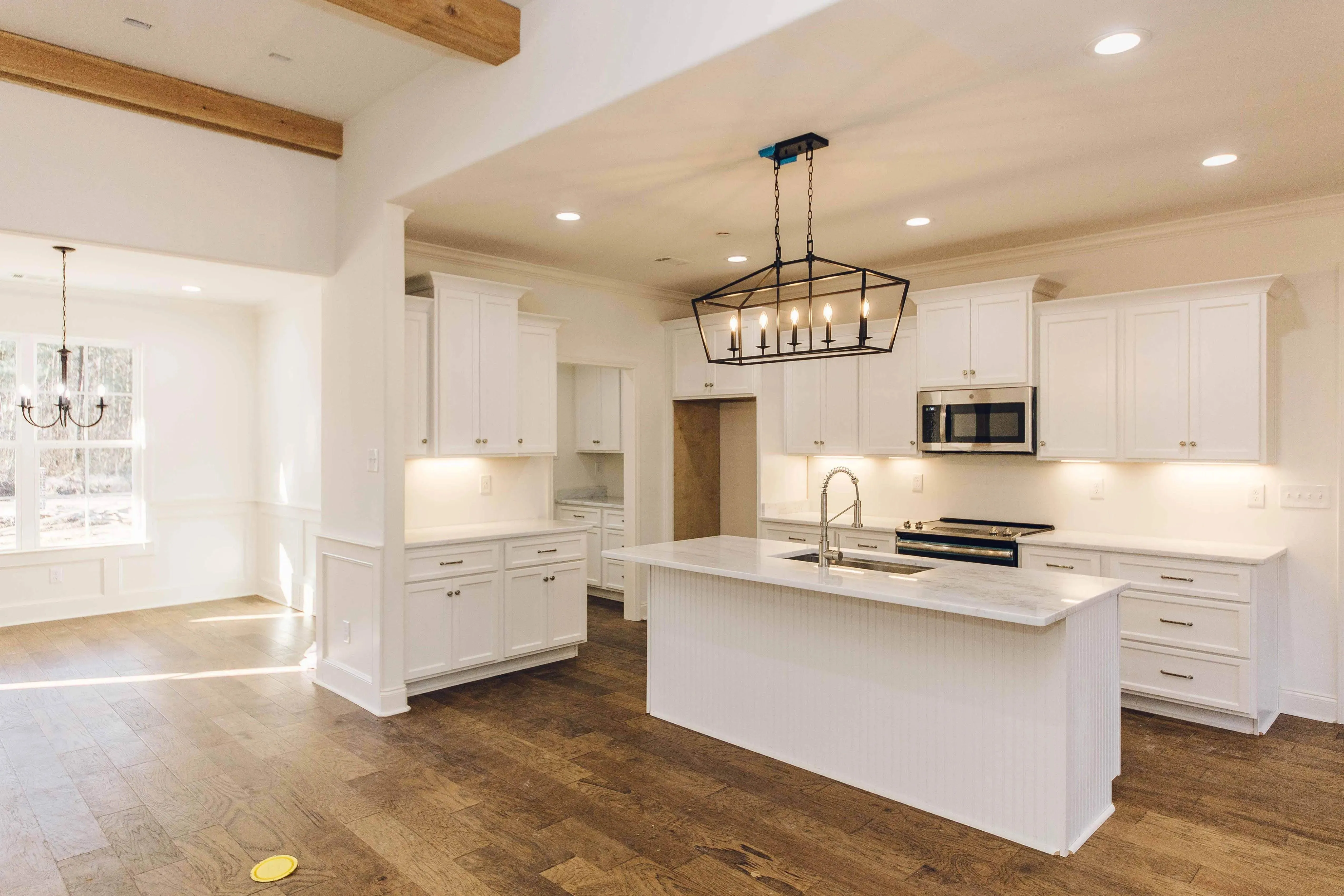 Elegant family home with spacious living, bonus room, and outdoor kitchen.