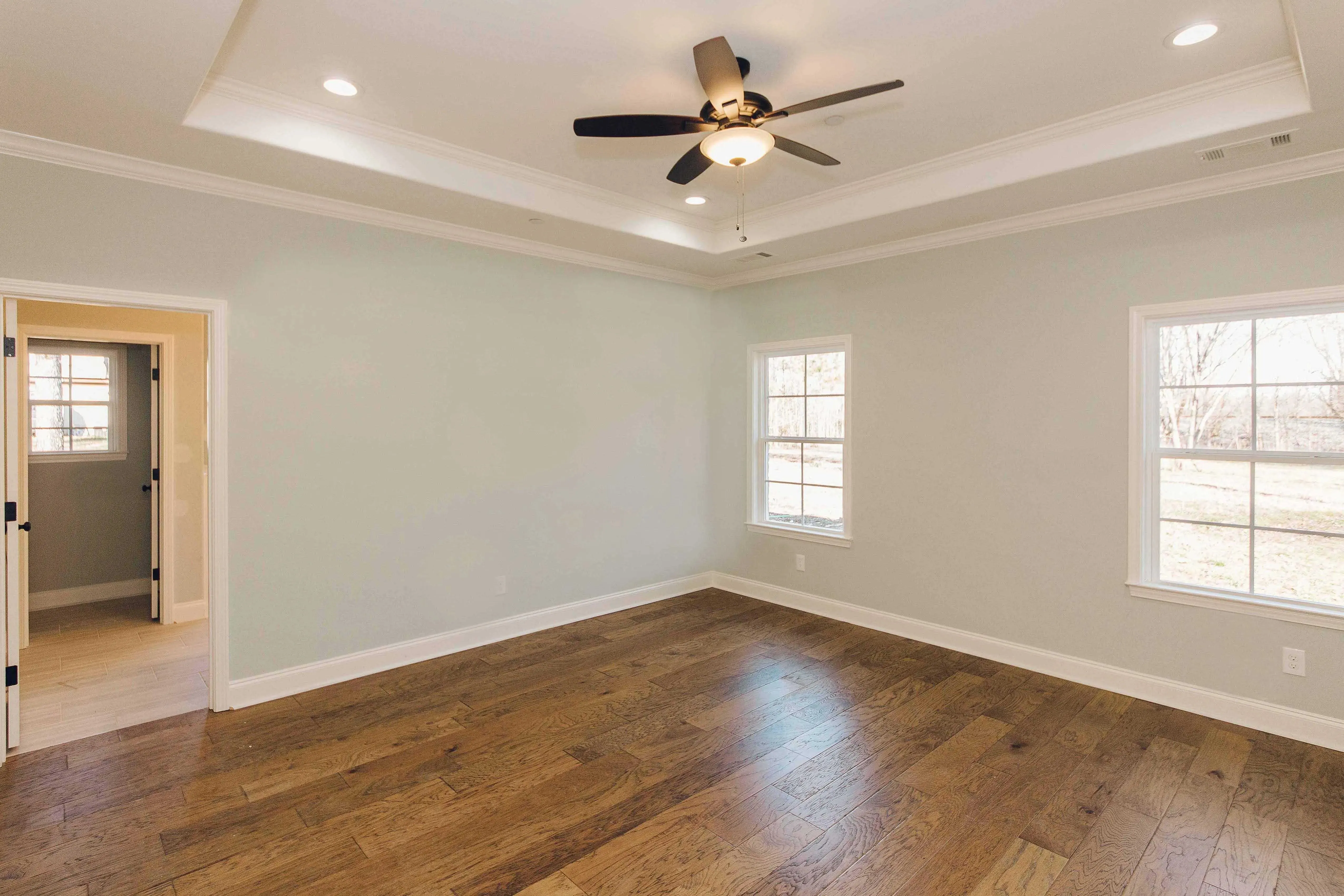 Elegant family home with spacious living, bonus room, and outdoor kitchen.