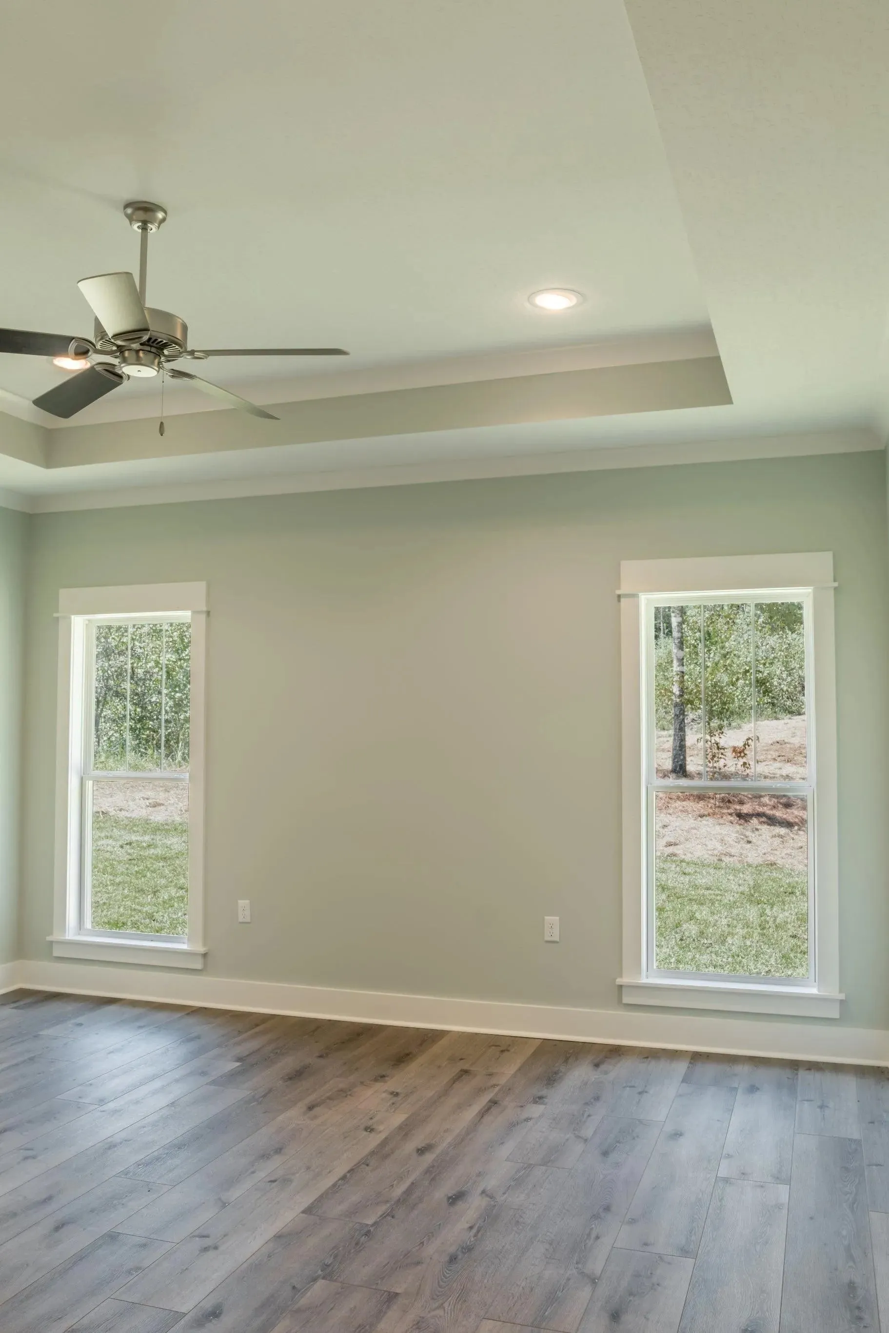 Elegant family home with spacious living, bonus room, and outdoor kitchen.