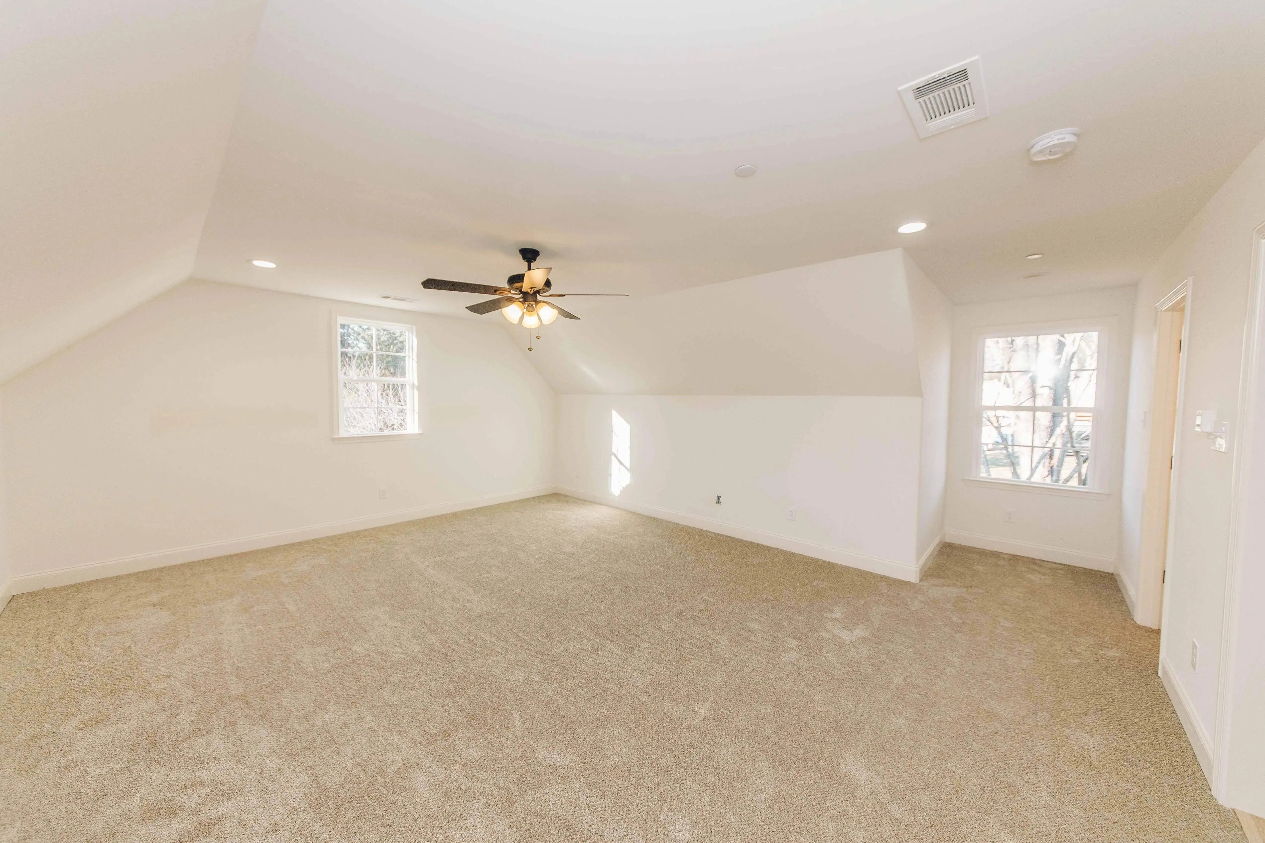 Elegant family home with spacious living, bonus room, and outdoor kitchen.
